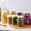imageAOZITA 10 WIDE Mouth ampamp 10 REGULAR Mouth Mason Jar Lids  20 Pack Food Grade Plastic Mason Jar Caps for Ball Kerr and More Canning Jars  Leakproof ampamp Dishwasher Safe  White10 Wide 10 Regular
